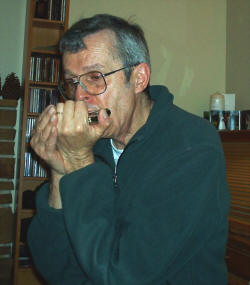 Walter A Cooke playing harmonica